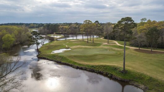 An aerial view of the par-4 14th green (foreground) and par-3 15th at Whispering Pines Golf Course in Trinity, Texas.  This is for Texas Golf 2022.  Whispering Pines was voted the No. 1 course in Texas.